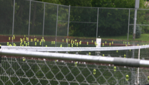Soggy Balls Litter High School Tennis Court